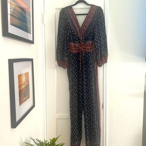 Romper with pockets, elastic backing.